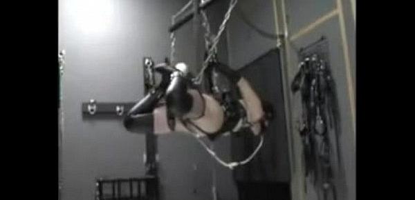  suspended slave girl in rubber